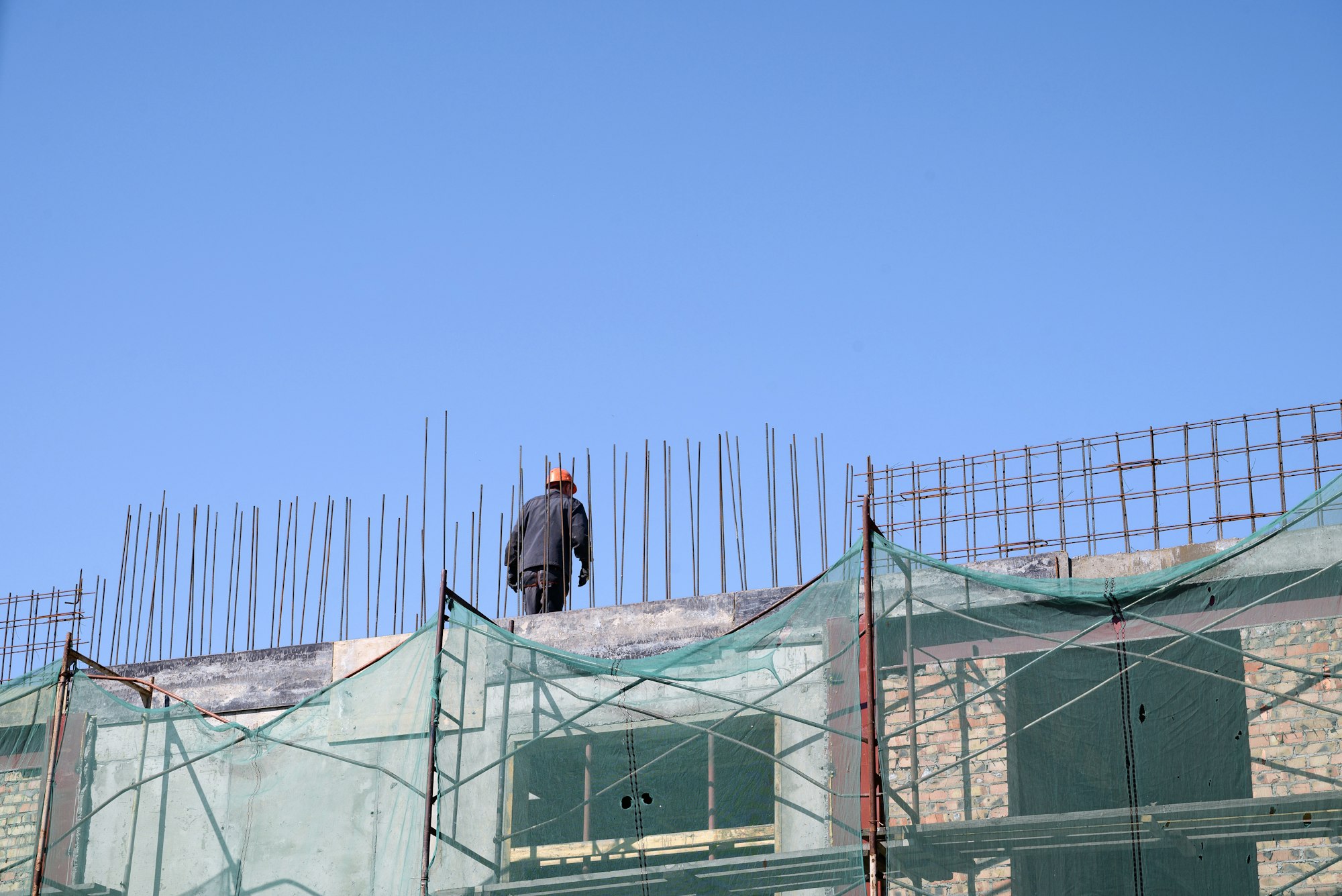 construction of a residential building. a tower crane at a construction site.